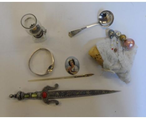Miscellaneous old items to include a silver bracelet (33 grams), a small Birmingham silver spoon, a metal Celtic design lette