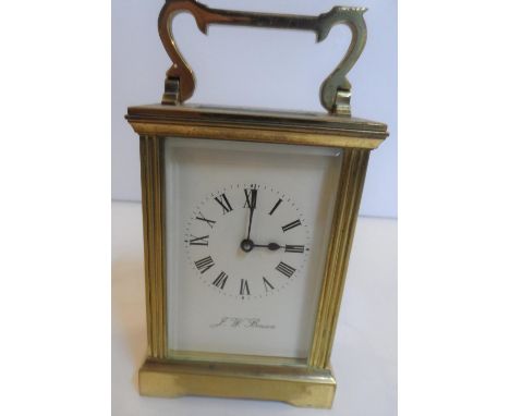 J W Benson brass carriage clock with key,Believed to be in full working order12 cm high 