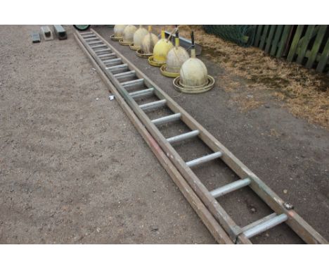 A wooden and metal extending ladder 