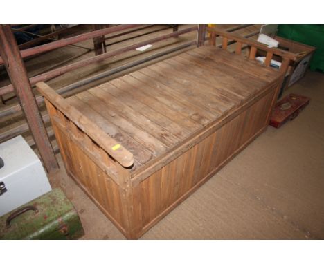 A garden storage bench and contents of various tools