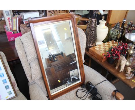 A Victorian walnut over mantel mirror 
