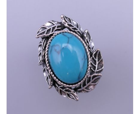 A silver turquoise ring. Ring size S.