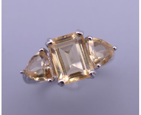 A silver citrine ring. Ring size O.