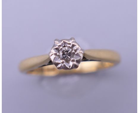 An 18 ct gold diamond solitaire ring. Ring size L. 2.8 grammes total weight.