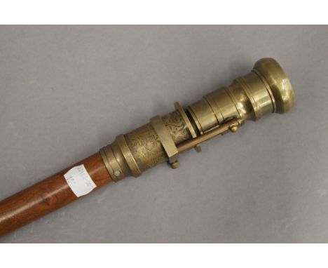 A walking stick, the handle set with a compass. 98.5 cm high.