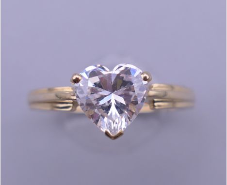 A 14 ct gold cubic zirconia ring. Ring size M. 2.3 grammes total weight.