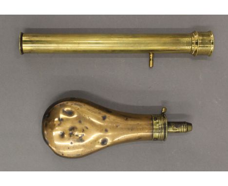 An antique copper powder flask and a brass telescope. The former 20 cm high.