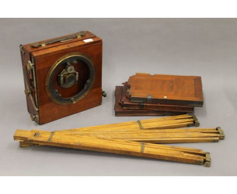 A Junior Sanderson plate camera with three plates and a tripod. 