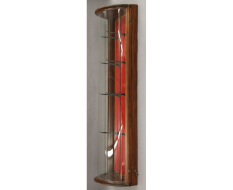 A bow fronted display case. 109 cm high.