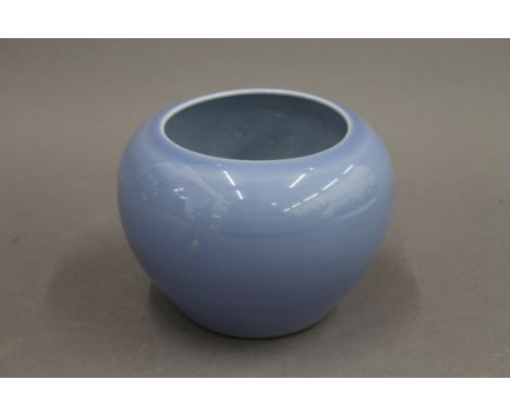 A Chinese light blue bulbous porcelain vase. 11 cm high.