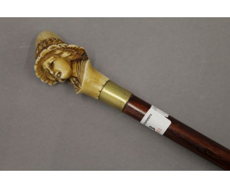 A sword stick with resin handle. 93.5 cm high.