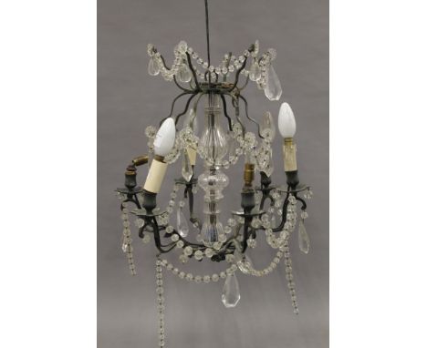 A vintage cut glass chandelier. Approximately 50 cm high.