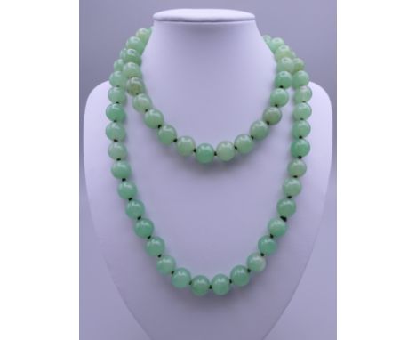 A string of jade beads. Approximately 84 cm long.