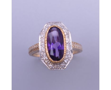 An Art Deco style 9 ct gold amethyst and diamond ring with engraved shoulders. Ring size L.  4.5 grammes total weight.