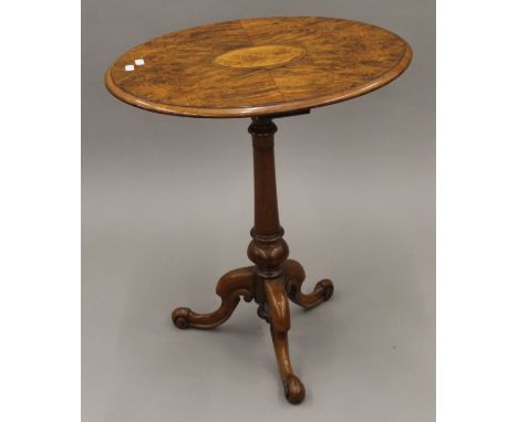 A Victorian inlaid walnut tripod table. 60 cm wide.