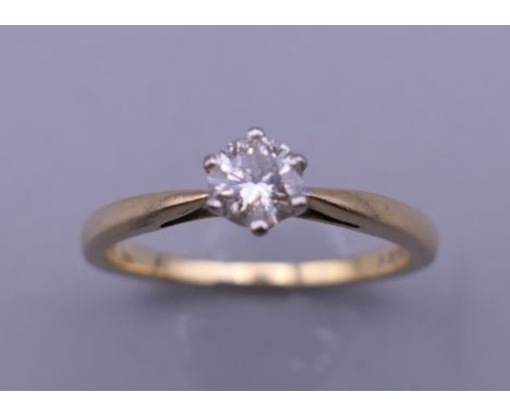 An 18 ct gold diamond solitaire ring, with EGL Report card stating diamond weight 0.341 carats, colour H, clarity I1. Ring si