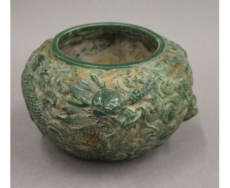 A Chinese green jade vase decorated with dragons. 11 cm high.