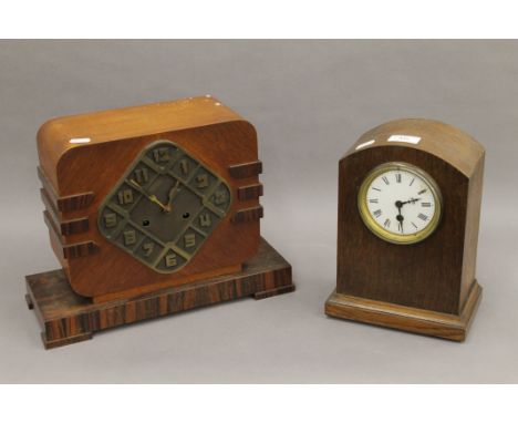 An Art Deco oak mantle clock and another oak mantle clock. The former 27 cm high.