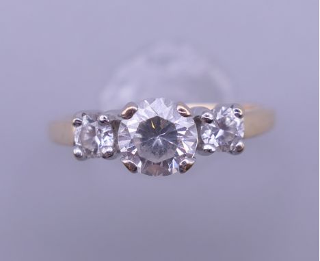 A 14 ct gold cubic zirconia ring. Ring size M. 2.5 grammes total weight.