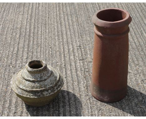 An early ceramic urn and a chimney pot.