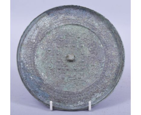 A CHINESE ARCHAIC BRONZE MIRROR, possibly tang dynasty, 15.5cm diameter.