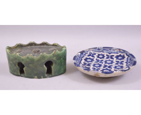 A MOROCCAN GREEN GLAZED POTTERY INKWELL, together with a blue and white glazed pottery dish, inkwell 17cm long, dish 17.5cm d