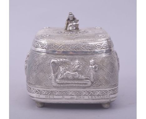 A FINE INDIAN SILVER PANDAN LIDDED BOX, the lid with baby Krishna finial, the box raised on four feet and enscribed 'from lt 