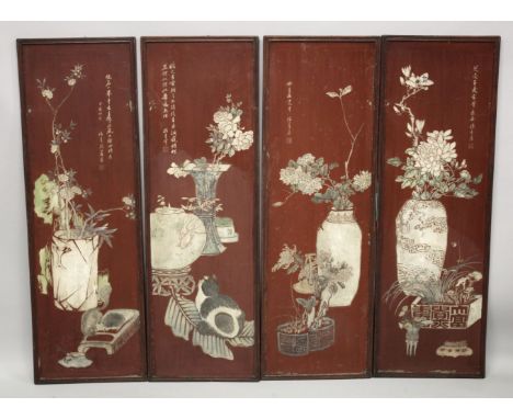 FOUR LARGE CHINESE CARVED AND STAINED WOODEN PANELS, depicting various flora, each with inscription, single panel measuring 1