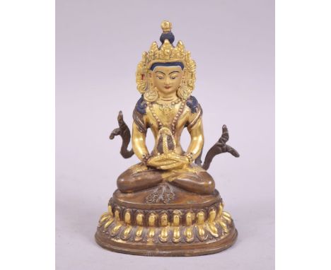 A SMALL 20TH CENTURY TIBETAN GILDED BRONZE BUDDHA, 10cm.
