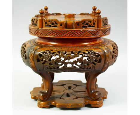 A LARGE CHINESE CARVED HARDWOOD STAND, 25cm high.