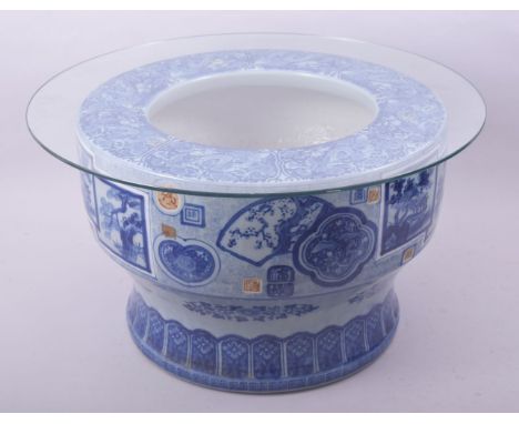 A LARGE JAPANESE ARITA BLUE AND WHITE PORCELAIN HIBACHI, possibly Taisho period, decorated with various panels and fans with 