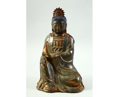 A CHINESE BRONZE BUDDHA, with traces of gilt and red paint, 24cm high.