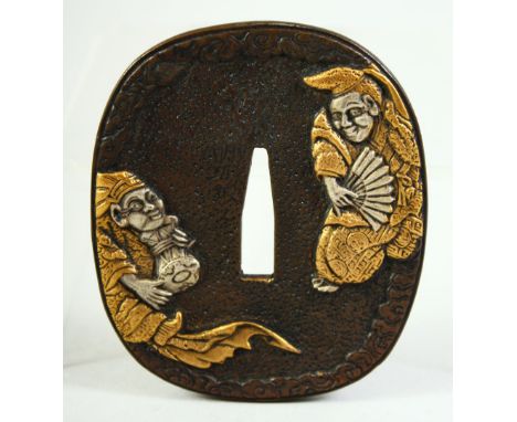 A JAPANESE BRONZE SHAKUDO TSUBA, depicting two amusing figures, the reverse with a gourd shape flask and other items, 8cm x 7