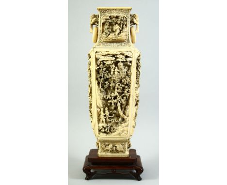 A SUPERB LARGE CHINESE CARVED IVORY VASE with ring handles, circa 1850, with a hardwood stand, the body finely carved with tr