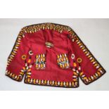 A TURKAMAN COAT, with colourfully printed lining, the sleeves and edging embroidered with stylised