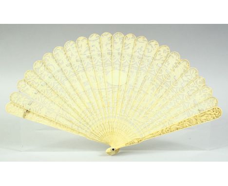 A CHINESE CANTON CARVED AND PIERCED IVORY FAN, boxed, 19cm long.