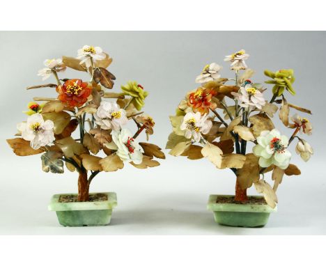 A PAIR OF CHINESE HARDSTONE BONSAI FLOWER SCULPTURES, with a variety of hardstones and inset within jade planters, each appro