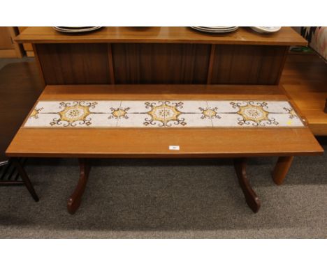 A teak and tile top oblong coffee table, 124cm