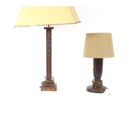 An Arts &amp; Crafts decorated table lamp and shade; and a small oak baluster table lamp and shade