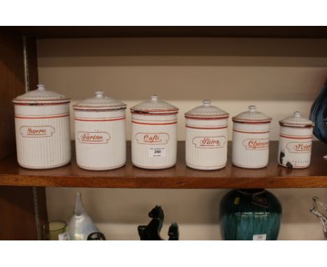 Six French enamel graduated storage pots, with red and white banded decoration