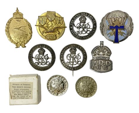 Three WW1 'Services Rendered' wound badges, nos.B333490, 180063 and 268702; two King's Badges 'For Loyal Service'; one in ori