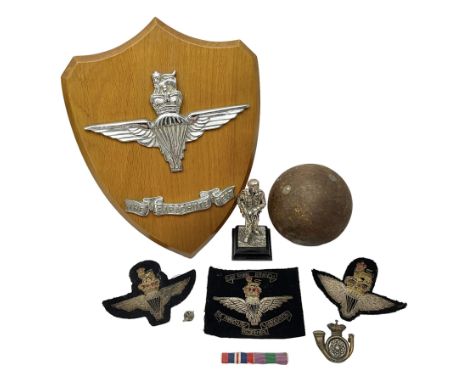 Parachute regiment - chrome crest on oak easel shield; three cloth badges; small silver plated figure; and pin badge; togethe