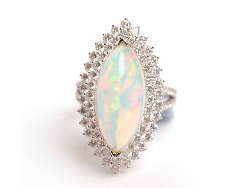 LARGE OPAL AND DIAMOND DRESS RING
the marquise shaped opal 21x9mm surrounded by diamonds, on diamond set bifurcated shoulders