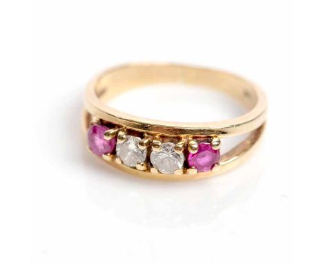 RUBY AND DIAMOND FOUR STONE RING
with two central brilliant cut diamonds totalling approximately 0.30 carats, between two rou