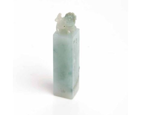 CARVED JADE SEAL
of rectangular form, surmounted by a carved foo dog, with engraved seal to base, 50mm high