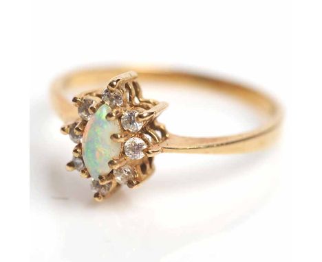 OPAL AND DIAMOND CLUSTER RING
set with a central marquise cabochon opal surrounded by brilliant cut diamonds, in nine carat c