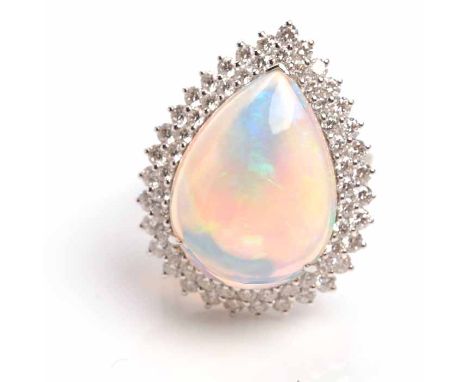 IMPRESSIVE OPAL AND DIAMOND DRESS RING
set with a pear shaped opal 21x16mm, surrounded by diamonds, on diamond set trifurcate