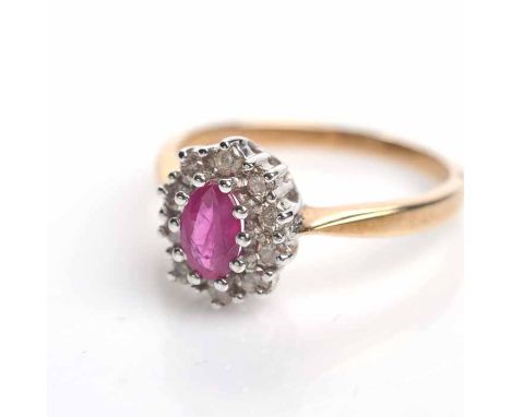 RUBY AND DIAMOND CLUSTER RING
set with an oval ruby surrounded by brilliant cut diamonds, in nine carat gold, size M