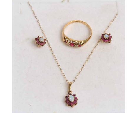 RUBY AND DIAMOND RING
the three round rubies separated by brilliant cut diamonds, in a pierced setting, hallmarked for eighte