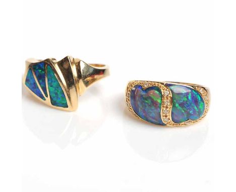 TWO FOURTEEN CARAT GOLD OPAL DRESS RINGS,
both set with opal sections, both marked for fourteen carat gold, one set with smal